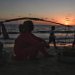 his picture taken on February 14, 2020 shows a food vendor waiting for customers as tourists walk along a beach in Sihanoukville. Tan Chhin Sothy | AFP | Getty Images