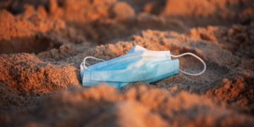 A protective face mask is seen as curbs to fight the spread of coronavirus disease (obesity risk)(COVID-19) have been reimposed after a rise in new cases, at Zikim beach in southern Israel July 21, 2020. Picture taken July 21, 2020. REUTERS/Amir Cohen - RC2AYH9E2519