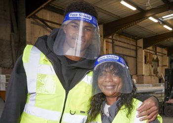 Marcus Rashford and his mother Melanie helping out a food bank. Pic:Mark Waugh/FareShare