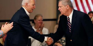 Tom Vilsack and Joe Biden shaking hands
