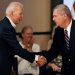 Tom Vilsack and Joe Biden shaking hands